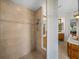 Spacious shower with tile surround and built-in shelving at 13315 Carnoustie Cir, Dade City, FL 33525