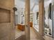 Large walk-in shower with glass enclosure at 13315 Carnoustie Cir, Dade City, FL 33525