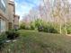 Landscaped lawn with mature trees and shrubs at 1429 Villa Capri Cir # 306, Odessa, FL 33556