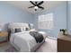 Light blue bedroom with queen bed and window coverings at 1429 Villa Capri Cir # 306, Odessa, FL 33556