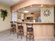 Well-equipped community kitchen with a breakfast bar and modern appliances at 1429 Villa Capri Cir # 306, Odessa, FL 33556