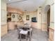 Community room with a small table and chairs, adjacent to a kitchenette at 1429 Villa Capri Cir # 306, Odessa, FL 33556