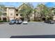 Tan multi-unit building with ample parking and landscaping at 1429 Villa Capri Cir # 306, Odessa, FL 33556