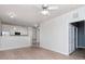Open living area with kitchen view and wood-look floors at 1429 Villa Capri Cir # 306, Odessa, FL 33556