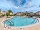 Resort-style pool with surrounding patio and lounge chairs at 1429 Villa Capri Cir # 306, Odessa, FL 33556