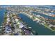 Wide aerial showcasing property's access to the waterfront and surrounding area at 158 Sun Isle Cir, Treasure Island, FL 33706