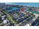 Aerial view of waterfront community with numerous homes and lush landscaping at 158 Sun Isle Cir, Treasure Island, FL 33706