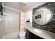 Clean bathroom with shower/tub combo and granite vanity at 158 Sun Isle Cir, Treasure Island, FL 33706