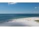 Expansive beach view with white sand and calm ocean waters at 158 Sun Isle Cir, Treasure Island, FL 33706