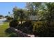 Community entrance with landscaping and building signage at 158 Sun Isle Cir, Treasure Island, FL 33706
