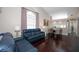 Spacious living room with hardwood floors and access to kitchen and dining area at 158 Sun Isle Cir, Treasure Island, FL 33706