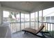 Private screened balcony with lounge chair and outdoor seating at 158 Sun Isle Cir, Treasure Island, FL 33706