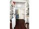 Large walk-in closet with ample shelving and hanging space at 158 Sun Isle Cir, Treasure Island, FL 33706