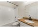 Clean bathroom with granite vanity and bathtub at 16431 Enclave Village Dr # 208, Tampa, FL 33647