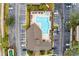 Overhead view of community pool with surrounding lounge chairs at 16431 Enclave Village Dr # 208, Tampa, FL 33647