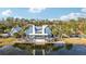 Community clubhouse with water views and a large deck at 16877 Red Brick Ln, Land O Lakes, FL 34638