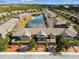 Aerial view of townhouses and pond in a residential area at 17284 Old Tobacco Rd, Lutz, FL 33558