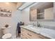 Clean bathroom with marble vanity and large mirror at 1752 Atrium Dr, Sun City Center, FL 33573