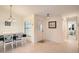 Bright dining area with white table and chairs at 1752 Atrium Dr, Sun City Center, FL 33573