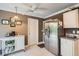 Kitchen with stainless steel appliances and white cabinets at 1752 Atrium Dr, Sun City Center, FL 33573