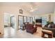 Living room with vaulted ceiling, brown recliner, and gray couch at 1752 Atrium Dr, Sun City Center, FL 33573