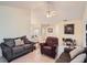 Living room with vaulted ceiling, brown recliner, and gray couch at 1752 Atrium Dr, Sun City Center, FL 33573