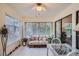 Relaxing sunroom with wicker furniture and large windows at 1752 Atrium Dr, Sun City Center, FL 33573