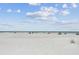 Expansive beach view showing white sands and beautiful sky at 18002 3Rd E St, Redington Shores, FL 33708