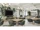 Community room with pool table, TV, and seating areas at 18491 Green Garden Ct, Venice, FL 34293