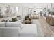 Open concept living and kitchen area with large sectional sofa at 18491 Green Garden Ct, Venice, FL 34293