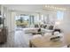 Spacious living area with access to a screened patio at 18491 Green Garden Ct, Venice, FL 34293