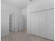 Bedroom with double door closet and access to bathroom at 2009 Gardenia Ave, Port Charlotte, FL 33953