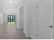 Clean hallway with tile floors leading to the living area at 2009 Gardenia Ave, Port Charlotte, FL 33953