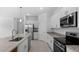 Modern kitchen with stainless steel appliances and granite island at 2009 Gardenia Ave, Port Charlotte, FL 33953