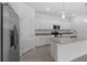 Modern kitchen with stainless steel appliances and granite island at 2009 Gardenia Ave, Port Charlotte, FL 33953
