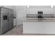Modern kitchen with stainless steel appliances and granite island at 2009 Gardenia Ave, Port Charlotte, FL 33953