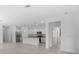 Open living room with kitchen and view to backyard at 2009 Gardenia Ave, Port Charlotte, FL 33953