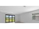 Bright living room with sliding glass doors leading to backyard at 2009 Gardenia Ave, Port Charlotte, FL 33953