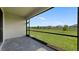 Screened porch overlooking the backyard and community at 2009 Gardenia Ave, Port Charlotte, FL 33953