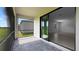 Screened porch with access to the backyard and interior at 2009 Gardenia Ave, Port Charlotte, FL 33953