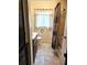 Bathroom with shower/tub combo and dark vanity at 21732 Bell Lake Rd, Land O Lakes, FL 34639