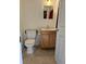 Simple bathroom with toilet and vanity at 21732 Bell Lake Rd, Land O Lakes, FL 34639