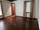 Spacious bedroom with hardwood floors and a door to another room at 21732 Bell Lake Rd, Land O Lakes, FL 34639