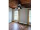 Bright bedroom with hardwood floors and ceiling fan at 21732 Bell Lake Rd, Land O Lakes, FL 34639