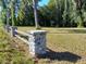 Stone and wood fence bordering a grassy area at 21732 Bell Lake Rd, Land O Lakes, FL 34639