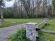 Stone pillars and wood fencing bordering a grassy area at 21732 Bell Lake Rd, Land O Lakes, FL 34639