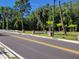 Roadside view of property with stone pillars and fencing at 21732 Bell Lake Rd, Land O Lakes, FL 34639