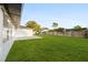 Large backyard with grassy lawn and patio at 2181 Wateroak N Dr, Clearwater, FL 33764