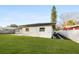 Side yard with grassy area and landscape edging at 2181 Wateroak N Dr, Clearwater, FL 33764