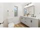 Modern bathroom with double vanity and a walk-in shower at 2181 Wateroak N Dr, Clearwater, FL 33764
